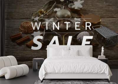 Composition of winter sale text over christmas decoration in background Wall mural