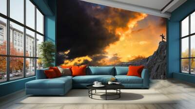 Cross religion symbol shape over sunset sky  Wall mural