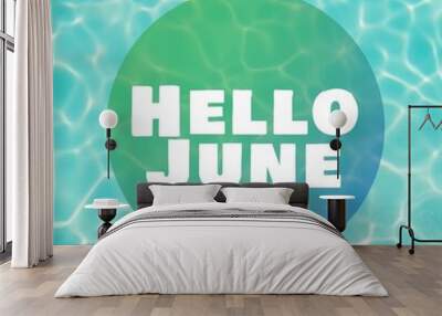 Digital composite image of hello june text over clear blue water in swimming pool on sunny day Wall mural