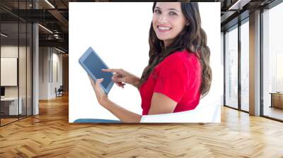 Digital png photo of happy caucasian woman using tablet with copy space on transparent background Wall mural