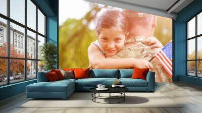 Portrait of girl hugging army officer father Wall mural