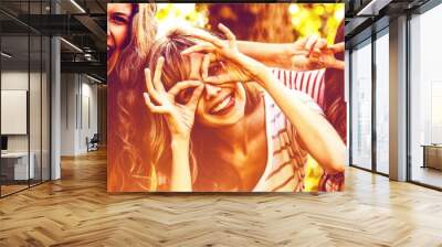 Portrait of happy friends taking selfie Wall mural