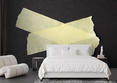 Ripped up pieces of masking tape with copy space on black background Wall mural