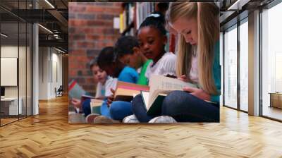 School library hosts diverse group of students, all reading books Wall mural