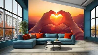 Human stands with arms outstretched, forming a heart shape, while the sun gleams at its center Wall mural