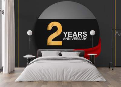 2 years anniversary logotype with golden color and red ribbon on black circle with glitter background isolated on black background. can be use for celebration and party Wall mural