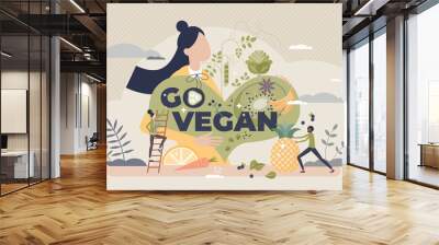 Go vegan as green and raw food eating for healthy diet tiny person concept. Lifestyle with vegetables, greens, plants or fruits consumption and exclude meat or animal products vector illustration. Wall mural