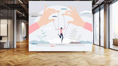 Manipulating people as control action with puppet strings tiny person concept Wall mural