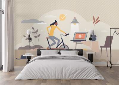 Stationary bicycle and indoor cycling activity trainer tiny person concept Wall mural