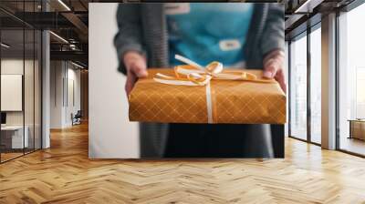 Midsection of woman holding present Wall mural