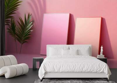 Aesthetic pink display with two rectangular boxes and a lush green plant, perfect for minimalist decor and style inspiration. Wall mural