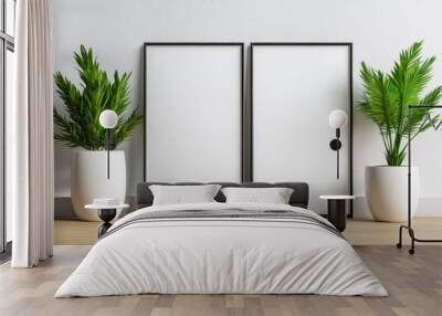 Stylish interior with two empty frames and lush green plants by a minimalist wall, perfect for home decoration ideas. Wall mural