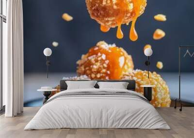 Tempting dessert featuring candy balls drizzled with caramel and sprinkled with nuts, perfect for food photography. Wall mural