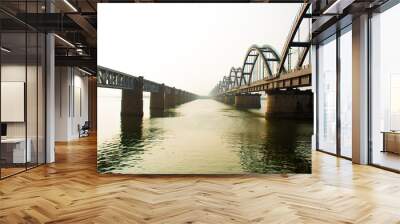 The Godavari Arch Bridge is a bowstring-girder bridge that spans the Godavari River in Rajahmundry, India. It is the latest of the three bridges that span the Godavari river at Rajahmundry.  Wall mural