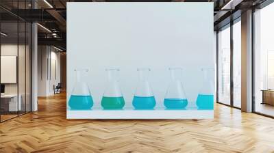 Beakers with Blue Liquid at Different Levels Wall mural