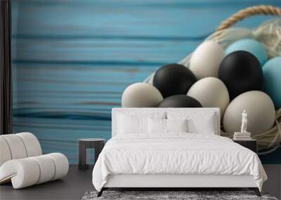 A basket of eggs with some black and white eggs. The basket is on a wooden table. The eggs are arranged in a way that they look like they are ready to be eaten Wall mural