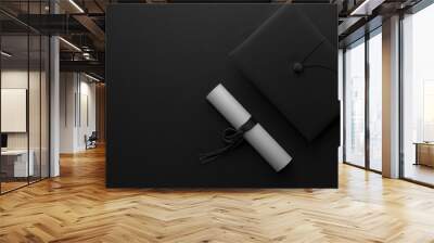 A black book with a black ribbon tied around it Wall mural