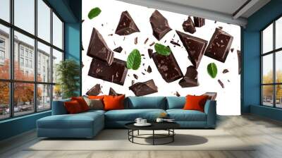 A close up of chocolate and mint leaves. The chocolate is broken into pieces and scattered across the image. Scene is playful and whimsical Wall mural