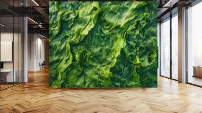 A close-up view of dense green algae or seaweed growing in an underwater environment. Wall mural