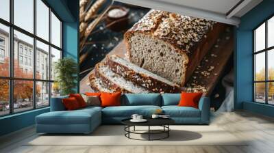 A loaf of bread with a few slices missing and a pile of oatmeal on a wooden cutting board Wall mural