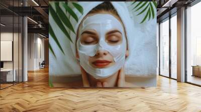 A person applying facial treatment at home Wall mural