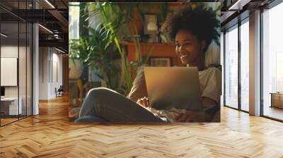 A woman smiling while relaxing on a couch and reading from a digital device, set in a cozy home interior. The room is tastefully decorated with potted plants. Wall mural