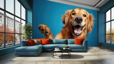 Heartwarming moment captures a happy dog waving its paw in a cheerful greeting against a vibrant blue background. Ideal for pet joy, greetings, and positive interactions-themed visuals. Wall mural