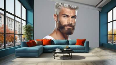 Mature man with a distinguished appearance, characterized by his white hair and beard. Wall mural