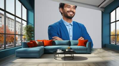 Picture of man wearing blue suit and smiling, with his arms crossed Wall mural