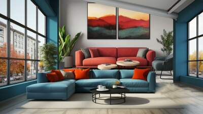 The two paintings on the wall are abstract and depict a mountain range. The room is decorated with a red couch, a coffee table, and a potted plant. The overall mood of the room is calm and serene Wall mural