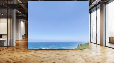 A bright blue sky meets a calm ocean The perfect summer day Wall mural