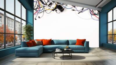 Many colorful electrical cord wires cables cord with plugs and electric socket on white background Wall mural