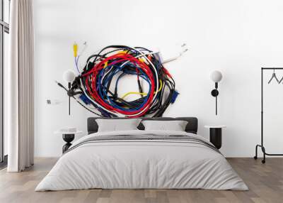 Many colorful electrical cord wires cord cables twist coiled into pile on white background. Top view Wall mural