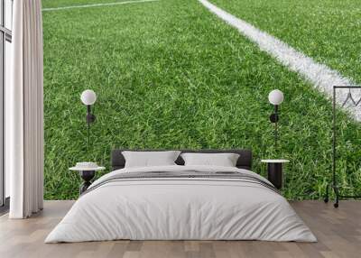 Soccer football background. Green synthetic artificial grass soccer sports field with white stripe line Wall mural