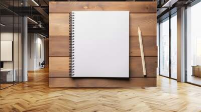 Top view of open spiral blank paper notebook with pencil on wooden table desk background. Top view Wall mural