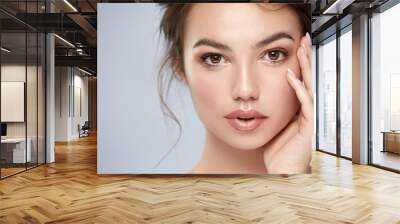 close-up portrait of beautiful girl with big eyes and perfect skin looking to camera Wall mural