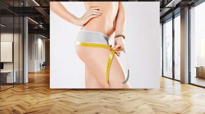 Fit girl's body in gray underwear Wall mural