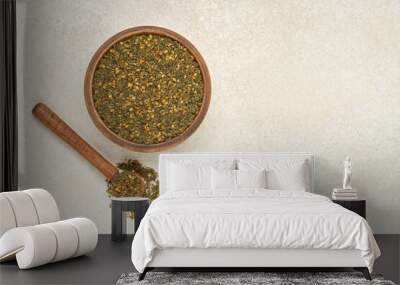 Mixed spice zaatar or zatar in wooden bowl. Top vie, copy space Wall mural