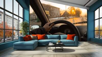 driving a driver on a sunny day. bright sunset from the window. Wall mural