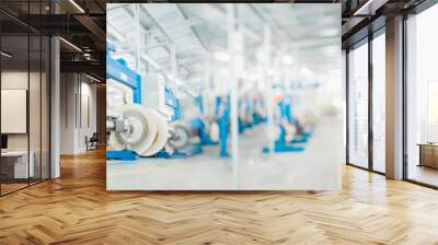 industrial production of fiber optic cable for telecommunication systems. Production of modern fiberglass and fiber optic cables at the plant. Copy space for text on blurred background. Wall mural