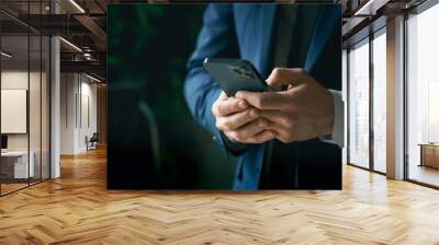 Businessman in suit with mobile phone in hands. Man typing message, using social net. Checking news. Making business meeting. Modern office.General manager,ceo.Calling to partner.Planning working day Wall mural