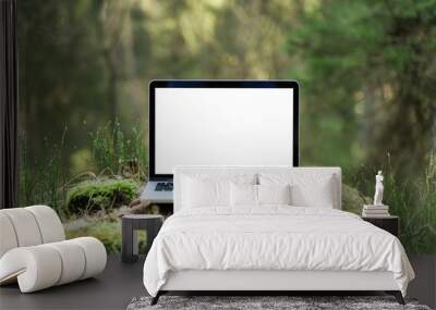 Laptop outside concept. Empty copy space, blank screen mockup. Soft focus laptop in nature background. Ecology travel and work outside office concept. Wall mural