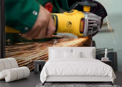 Worker cutting metal hand work angle grinder sparks. Wall mural