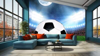 Soccer ball in grass, soccer stadium with the dright lights Wall mural