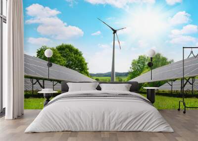 Solar energy panels with wind turbine in summer landscape. Power plant using renewable energy. Wall mural