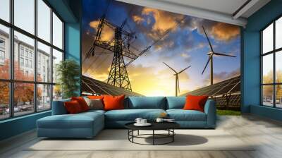 Solar panels with wind turbines and electricity pylon at sunset. Clean energy concept. Wall mural