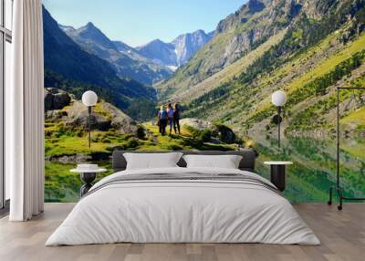 Tourists at Gaube lake. Mountains landscape in the Pyrenees, France. Wall mural