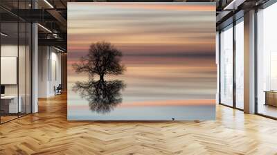 silhouette of tree on calm ocean water landscape at sunset Wall mural