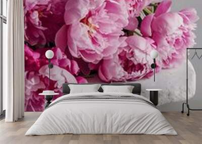 Beautiful pink peony flowers on white stone table Wall mural