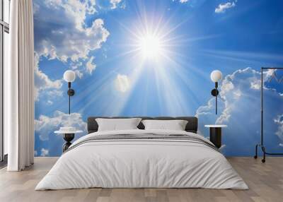 Bright sun rays casting light on a partly cloudy sky, cheerful atmosphere Wall mural